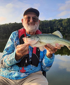 Ken Jolly holding a fish he caught
