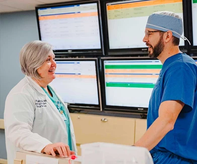 Woman and man talking in hospital