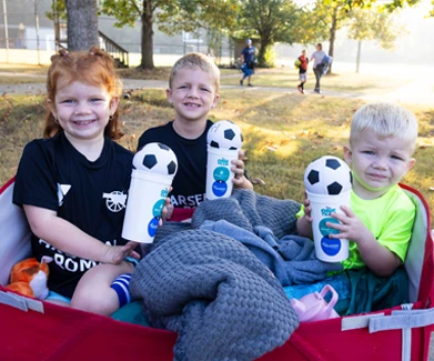 Kids sitting in a wagon