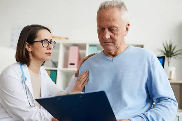 doctor and patient looking at a clipboard