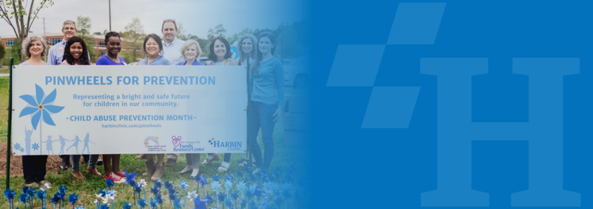 Team photo from the “Pinwheels for Prevention” campaign – ideal for awareness month features or community outreach content