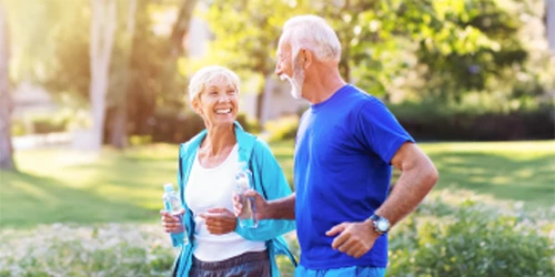 Smiling couple jogging together.