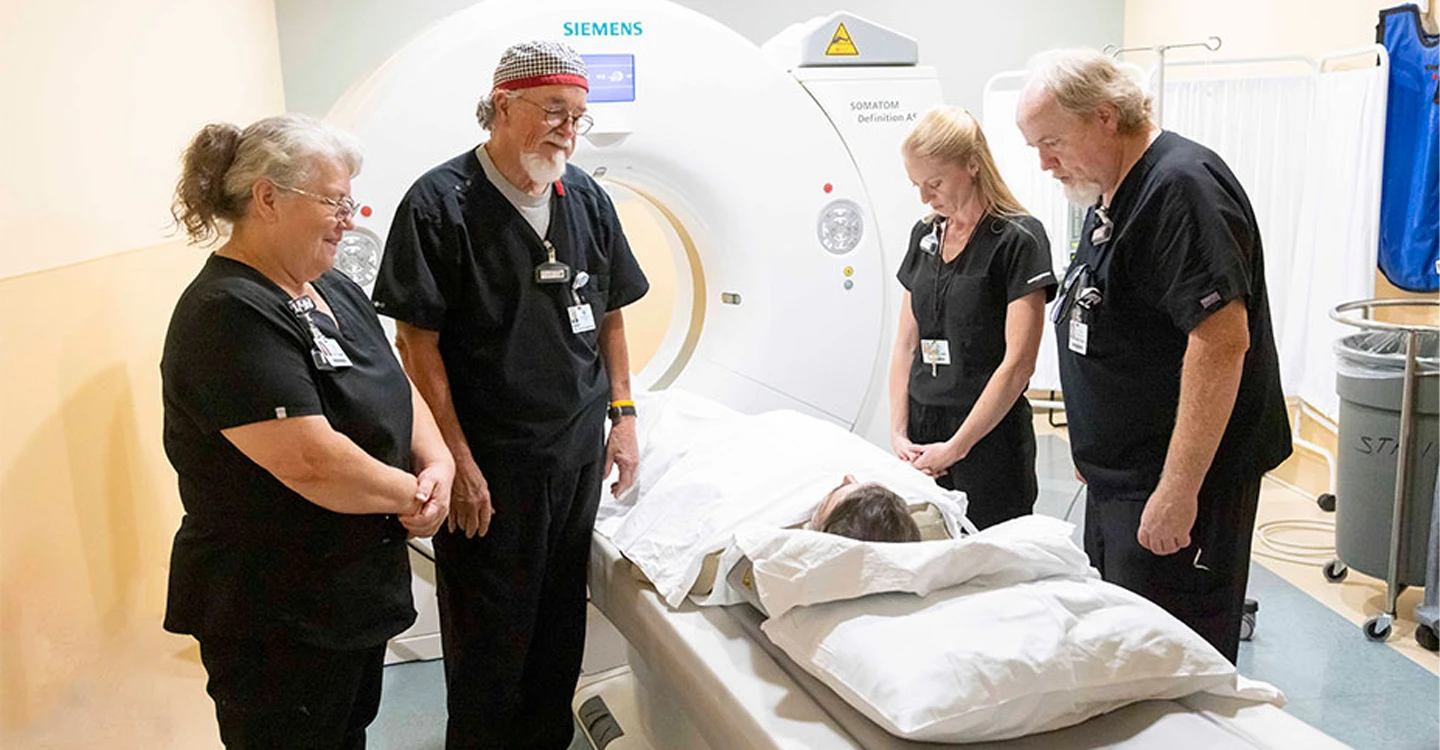 Attentive Teammates Offer Timely Prayer for Husband and Wife.