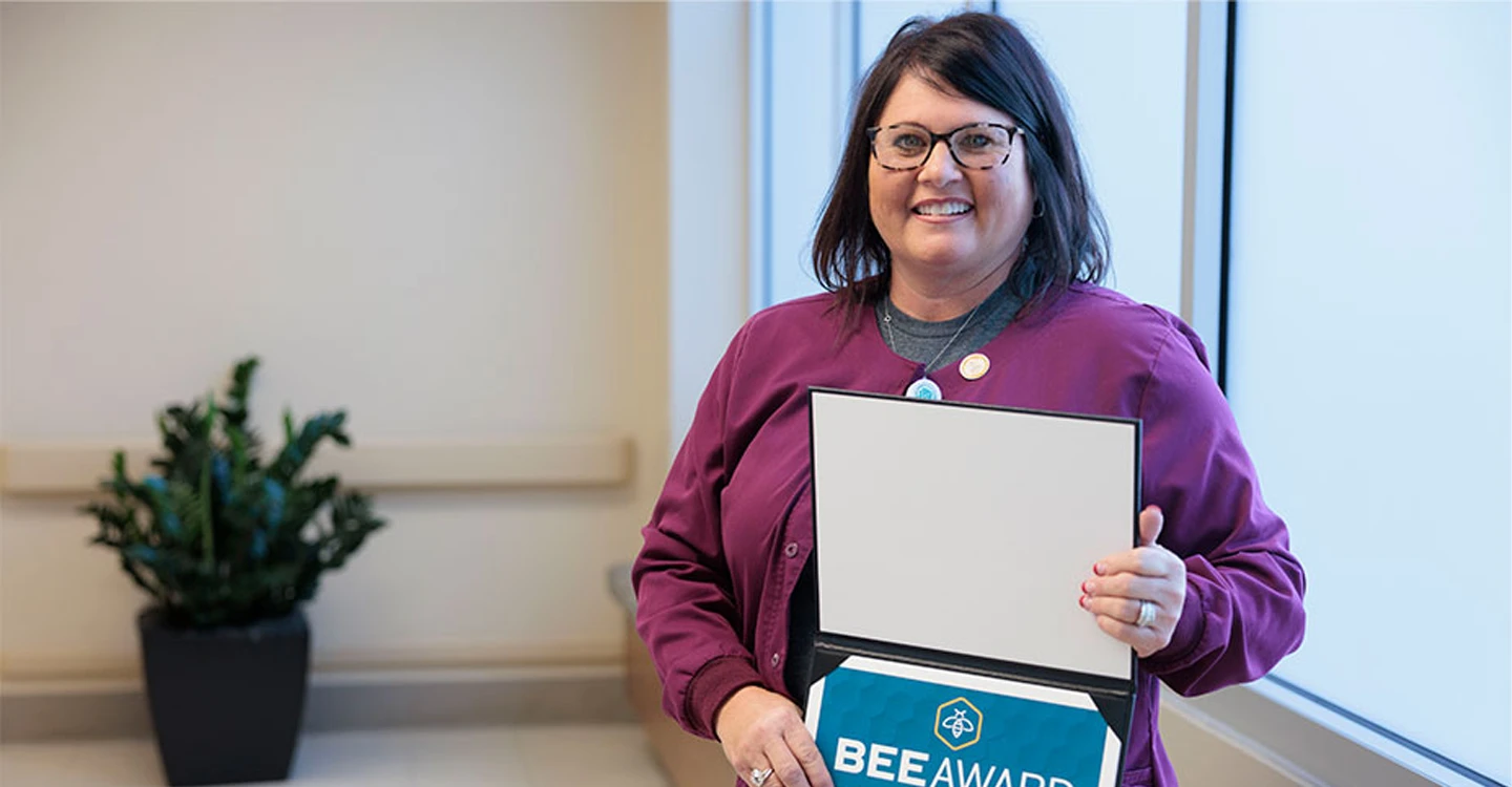 Hand-holding Teammate Makes Difficult Ride Easier for Patient.